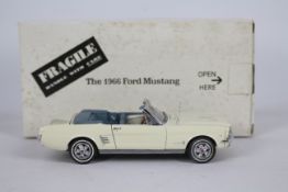 Danbury Mint - A boxed 1:24 scale diecast 1966 Ford Mustang Convertible by Danbury Mint.
