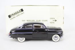 Danbury Mint - A boxed 1:24 scale diecast 1949 Mercury Club Coupe GTO by Danbury Mint.