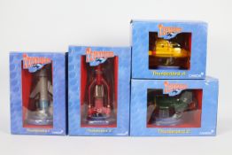Carlton - Thunderbirds - 4 x numbered limited edition resin figures of Thunderbird 1, 2, 3 and 4.