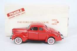 Danbury Mint - A boxed 1:24 scale diecast 1940 Ford Deluxe Coupe by Danbury Mint.