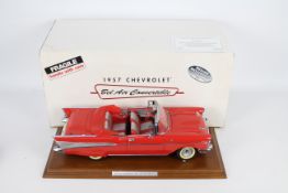 Danbury Mint - A boxed 1:12 scale 1957 Chevrolet Bel Air Convertible by Danbury Mint.