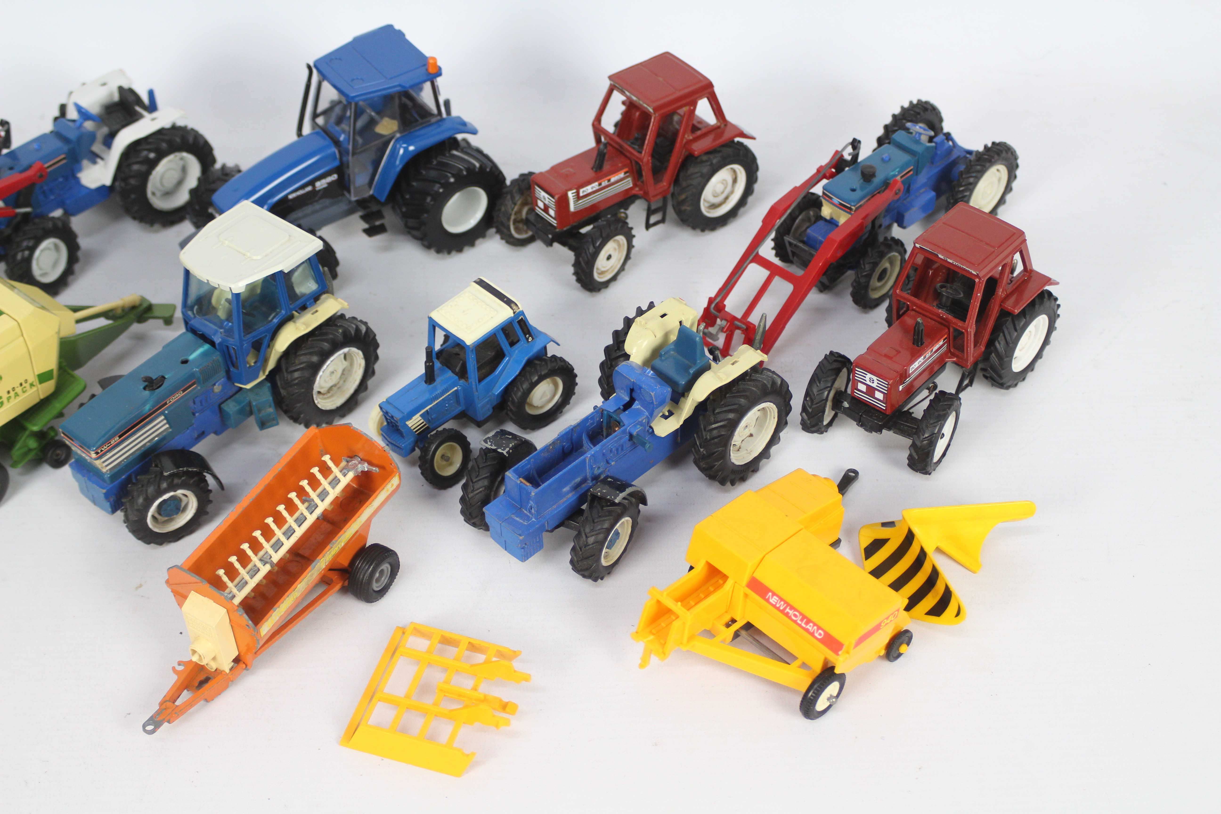 Britains, Others - A collection of 11 unboxed diecast and plastic farm vehicles and implements, - Image 3 of 3