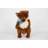 Unknown Maker - A fox with blue glass eyes and a blue bow-tie.