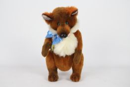 Unknown Maker - A fox with blue glass eyes and a blue bow-tie.