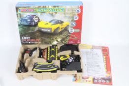 Scalextric - Micro Scalextric - A boxed Hot Pursuit set with Police SUV and a Rasio C-20.
