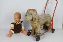 Triang, Other - An unboxed and unmarked vintage child mannequin doll with a Triang Push-Along-Dog.