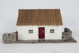 Unconfirmed Maker - An interesting and well constructed model of a thatched stone cottage,