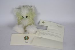 White Forest Bears - A mint-green mohair bear named 'Orion' with hand-painted eyes,