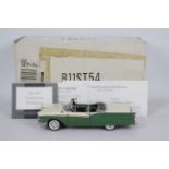 Franklin Mint - A boxed 1:24 scale 1957 Ford Fairlane 500 Skyliner by Franklin Mint.