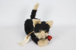 Maureen's Ragamuffins - A fully jointed 100% mohair cat with glass eyes and a stitched nose called