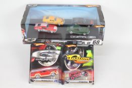 Hot Wheels - 6 x cars in 1:50 scale, a display box of four 'Soul of '68' Ford Mustang set # M7751,