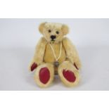 Waverley Paige - A small fully jointed long limbed bear with red leather pads and the makers label