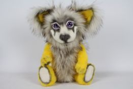 Unknown Maker - A yellow-coloured dog with purple-coloured glass eyes.