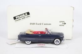 Franklin Mint - A boxed 1:24 scale 1949 Ford Custom by Franklin Mint.