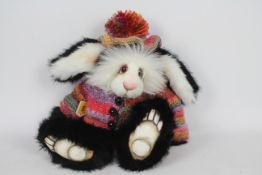Unknown Maker - A soft toy rabbit with the name 'Jal' imprinted on its right foot.