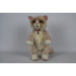 Unknown Maker - A jointed pink and white cat with green eyes, there is no makers label visible,