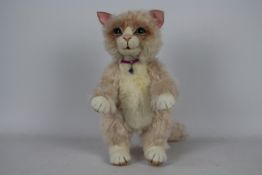 Unknown Maker - A jointed pink and white cat with green eyes, there is no makers label visible,