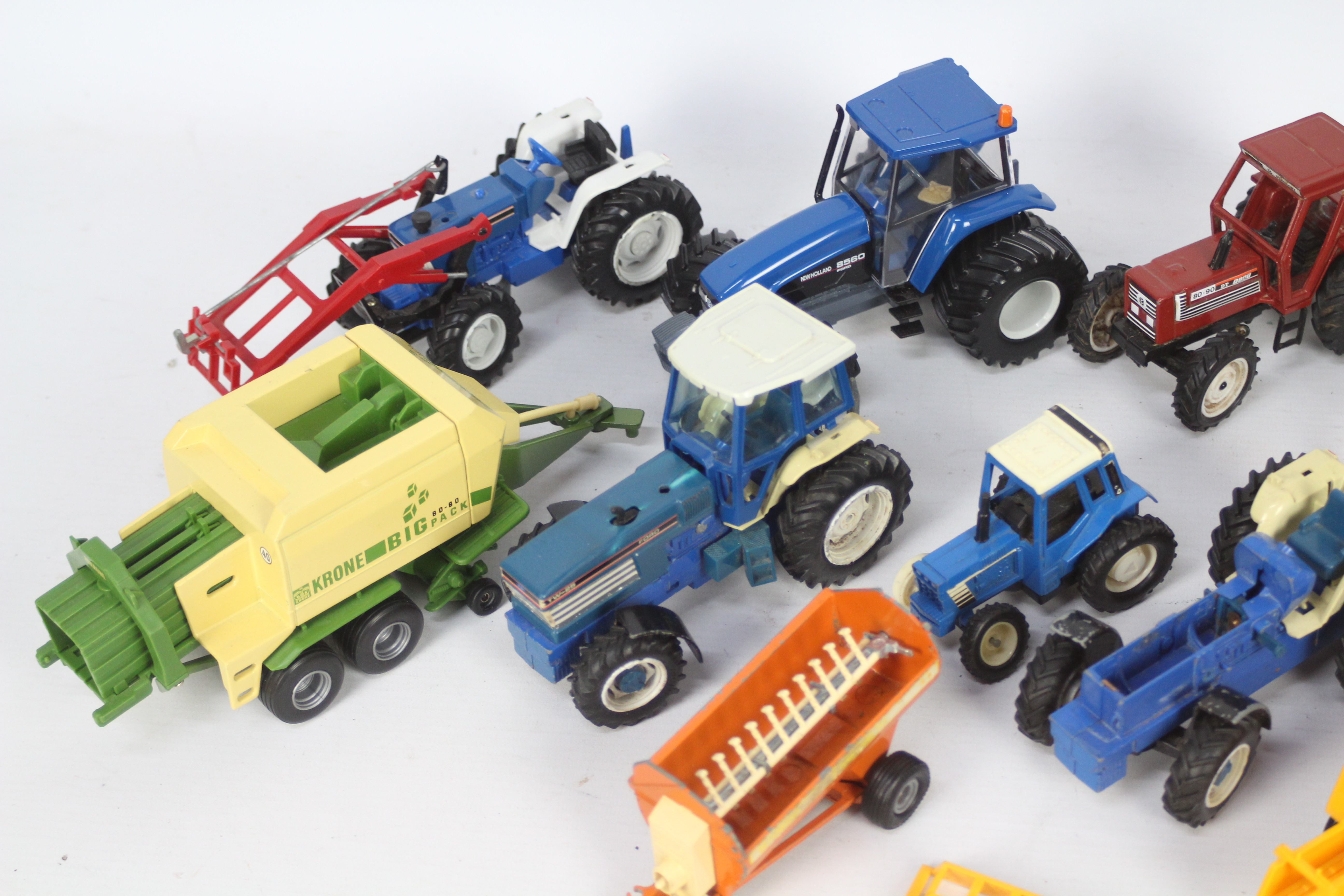 Britains, Others - A collection of 11 unboxed diecast and plastic farm vehicles and implements, - Image 2 of 3