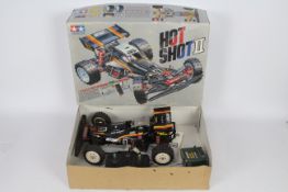 Tamiya - An assembled and boxed Tamiya 1:10 scale RC 'Hot Shot II' High Performance Off Road Racer.