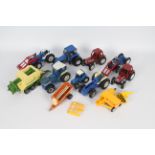 Britains, Others - A collection of 11 unboxed diecast and plastic farm vehicles and implements,
