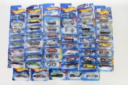 Hot Wheels - 50 x unopened carded models from the early 2000s including Morris Mini Cooper # J8017,