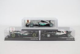 Minichamps - Three boxed 1:43 scale 'Lewis Hamilton' F1 racing car resin models.