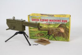 Benbros - A rare boxed Benbros Qualitoy Quick Firing Machine Gun On Tripod.