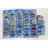 Hot Wheels - 50 x unopened carded models from the early 2000s including Cockney Cab II # G6731,