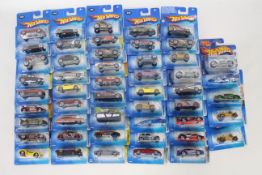 Hot Wheels - 50 x unopened carded models from the early 2000s including Cockney Cab II # G6731,