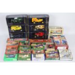 Lledo - A boxed grouping of diecast Lledo model vehicles and coin banks.