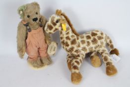 Steiff - An unboxed Steiff #110405 Giraffe approx 32cms (H) with Steiff button and yellow tag to