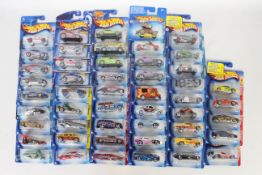 Hot Wheels - 50 x unopened carded models including full set of 5 x Ferrari Heat cars,