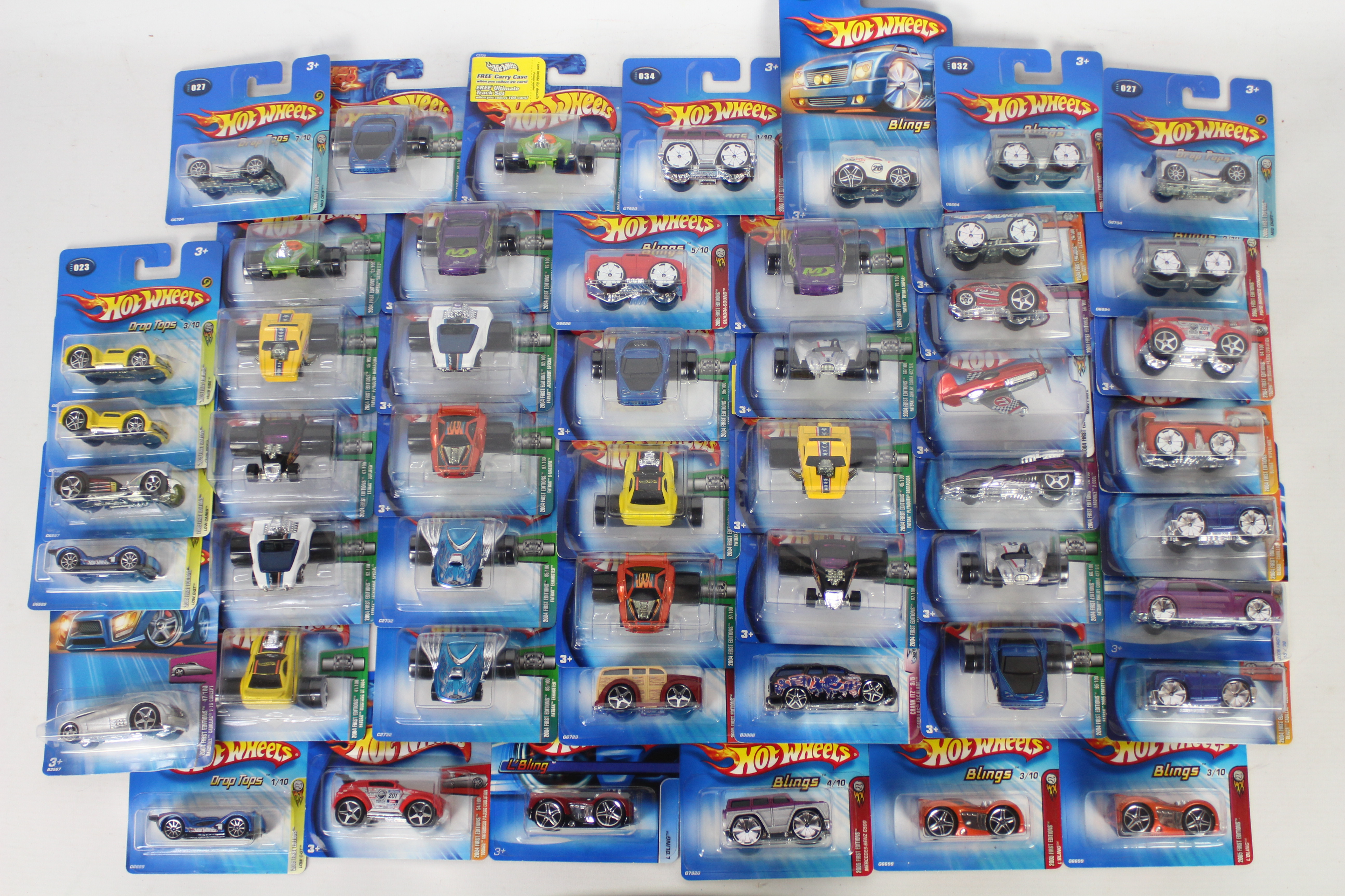 Hot Wheels - 50 x Unopened carded models from the early 2000s including Fatbak Plymouth Barracuda #