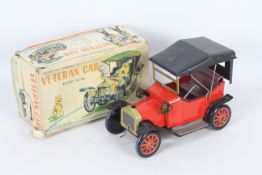 Yonezawa - A boxed battery operated Veteran Car witch has operating front lights,