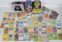 Collection of Pokemon cards 147 in total, 2 Pokemon Trading card game tins, Star Wars tin lunch box.