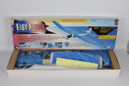 A boxed remote control "Easy pigeon" airplane.