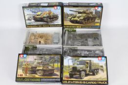 Tamiya - Four boxed plastic model military vehicle kits in 1:48 scale by Tamiya.