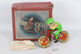 Tri-ang - A boxed 1930s Tri-ang Gyro Cycle toy in green.