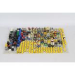 Lego - A collection of more than 50 Lego figures in component form on a Lego base mat.