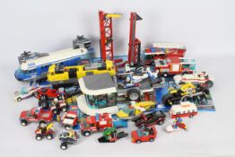 Lego - A collection of Lego City items including # 3368 Rig, # 60026 Bike Shop,
