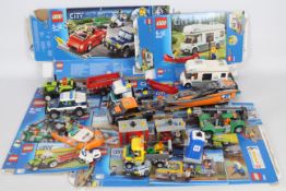 Lego - 8 x Lego City vehicles including Camper van # 60057, Truck & boat # 60085,