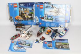 Lego - A collection of Lego vehicles including the Jaws set # 60015, Police set # 60009 and others.