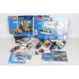 Lego - A collection of Lego vehicles including the Jaws set # 60015, Police set # 60009 and others.