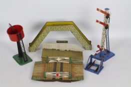 Hornby - A collection of 0 gauge track side items, a level crossing, water tower, foot bridge,