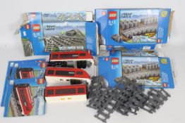 Lego - A collection of Lego Train and track items including # 7398 Train and # 7499 Track sections.