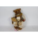 Old Time Teddies - A brown-coloured mohair bear by Kate Berlin. The bear's eyes are glass.