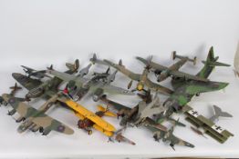 A fleet of constructed and painted plastic model military aircraft kits in a variety of scales.