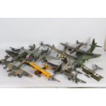 A fleet of constructed and painted plastic model military aircraft kits in a variety of scales.