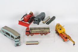 Dinky - a collection of playworn Dinky diecast model vehicles to include a Bedford Car Transporter,