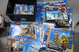 Lego - A collection of over 100 Lego set instruction books and over 30 empty flat packed Lego set